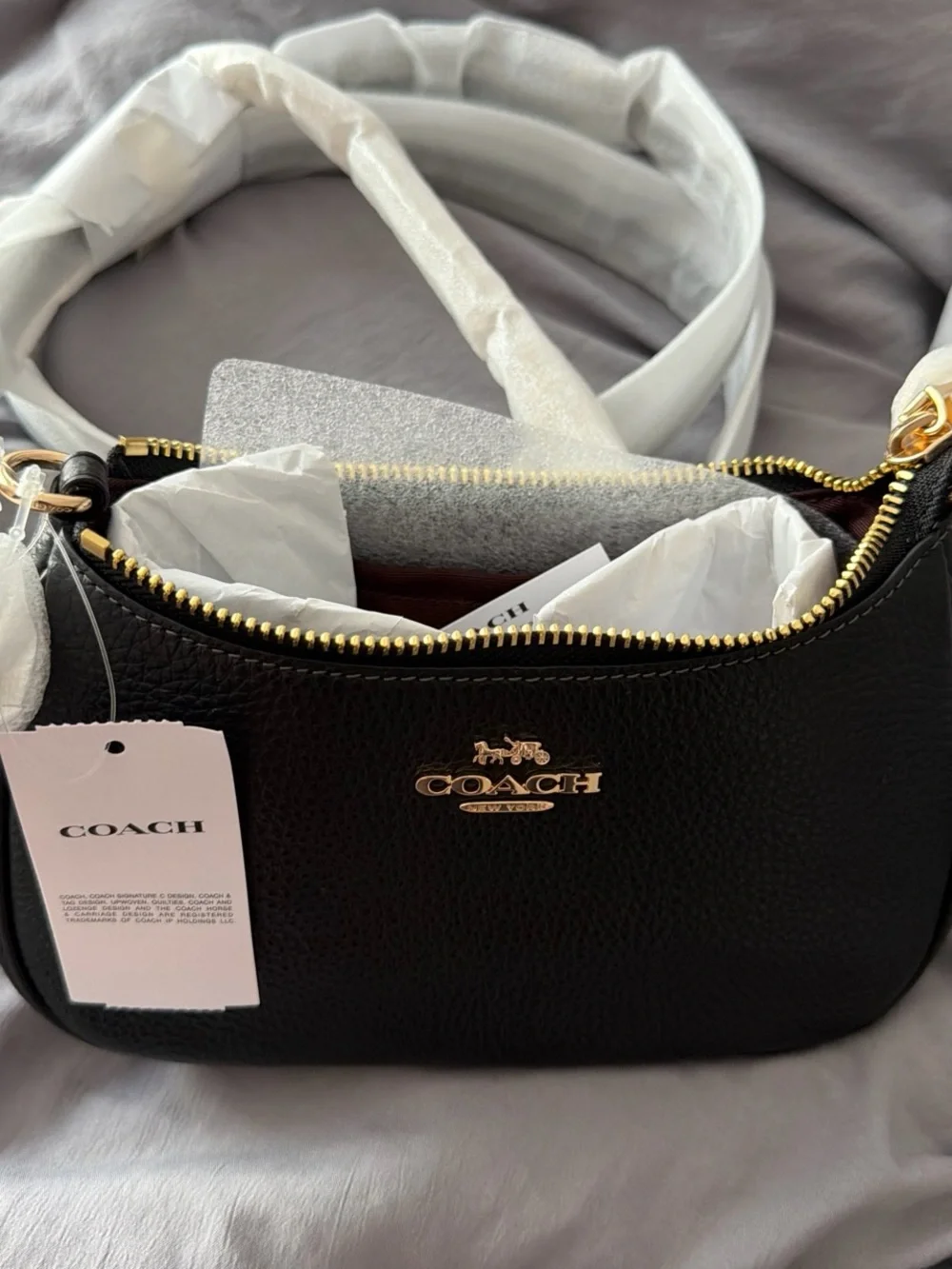 COACH Teri Mini Black Pebbled Leather Shoulder Bag with Gold Hardware.